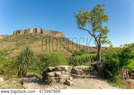 Isalo National Park In Ihorombe Region. Wilderness Landscape With Water Erosion Into Rocky Outcrops,
