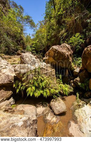 Isalo National Park In Ihorombe Region. Wilderness Landscape With Water Erosion Into Rocky Outcrops,