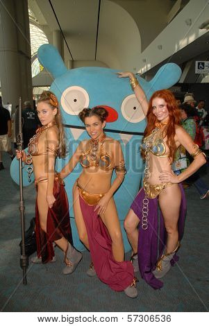 Paula Labaredas, Alicia Arden and Phoebe Price  at the annual Slave Leia Group Photo at ComicCon, San Diego Convention Center, San Diego, CA. 07-23-10
