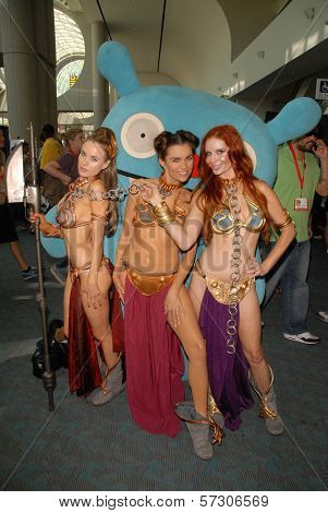 Paula Labaredas, Alicia Arden and Phoebe Price at the annual Slave Leia Group Photo at ComicCon, San Diego Convention Center, San Diego, CA. 07-23-10