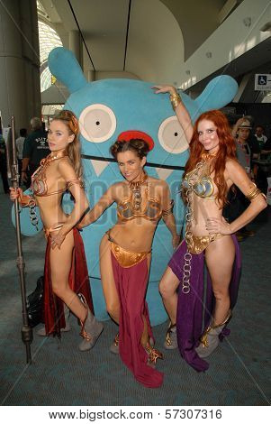 Paula Labaredas, Alicia Arden and Phoebe Price at the annual Slave Leia Group Photo at ComicCon, San Diego Convention Center, San Diego, CA. 07-23-10