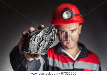 Coalminer Showing Lump Of Coal