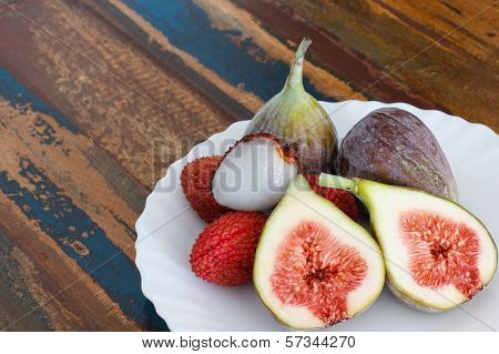 Lychee And Figs On A Wooden Table
