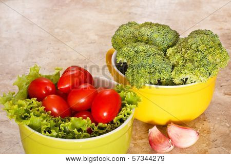 Fresh Broccoli, Tomatoes In Bowls