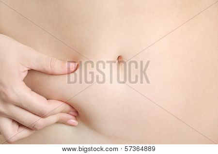Woman Pinches Her Waist