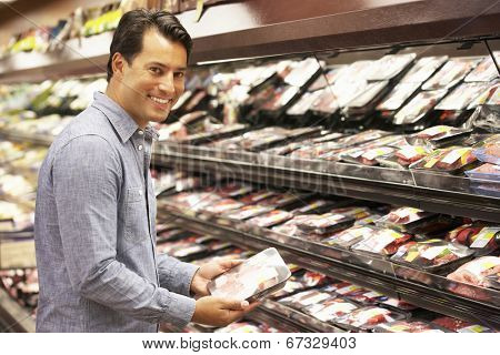 Man shopping in supermarket