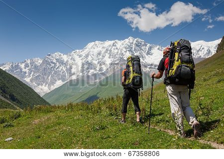 Hikers In Caucasus Mountains Of Zemo (upper) Svaneti, Georgia