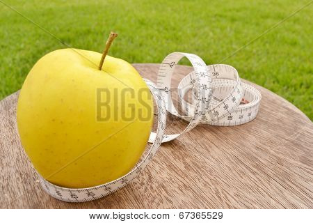 Apple and tape measure