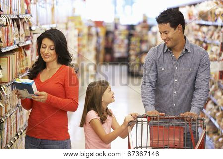 Family shopping in supermarket