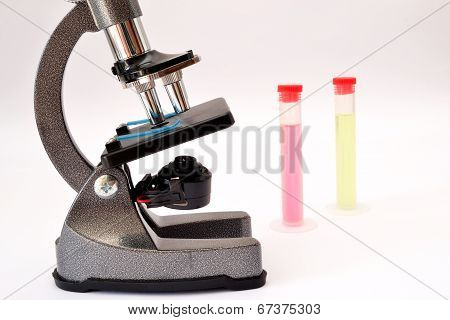 microscope and test tubes isolated on white background