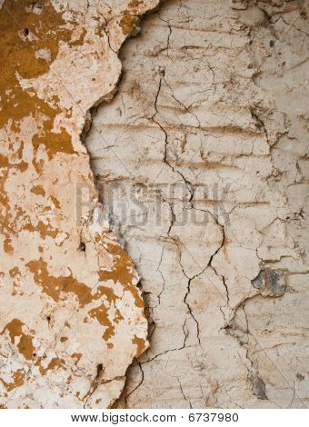 Broken Textur von der Wand mit moody orange Farbe.