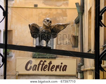 Prague, Czech Republic - June 15, 2006: Man-bird Sculpture In Old Town Patio Near Caffeteria Cafe On