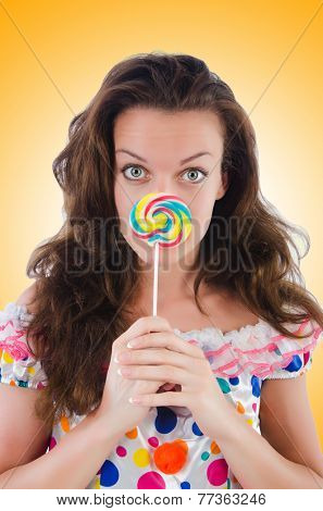 Woman with lollipops isolated on white
