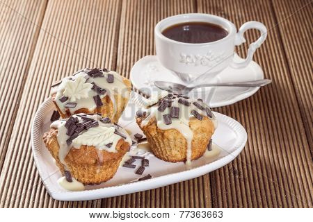 Delicious muffins with chocolate decoration