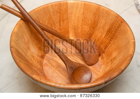 Wood Bowl And Spoons On Atable