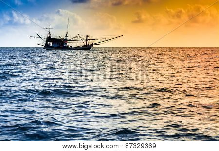 Fishing Boat On The Water At Sunset