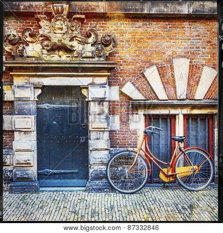 urban scenery of Holland. old door with bisycle