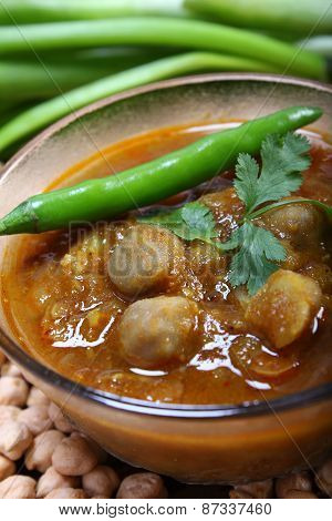 Indian Spicy Chana Masala With Raw Chickpeas And Green Chilli Topping