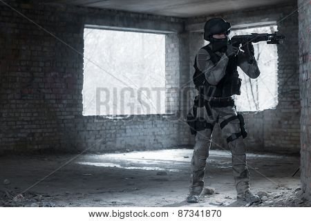 Airsoft strikeball player in military soilder uniform