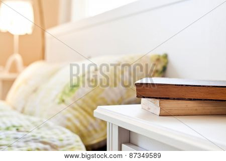 bedroom with books on nightstand