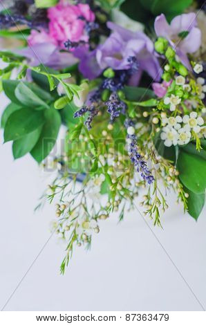 Bouquet of spring violet flowers on white isolated background. Fresh and green.