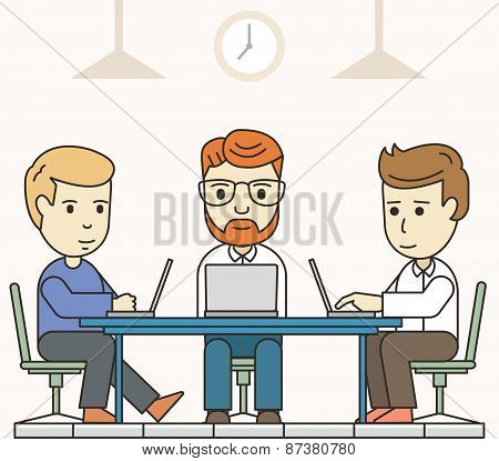 Business Meeting In Shared Working Environment. People Working At The Computers In The Workspace