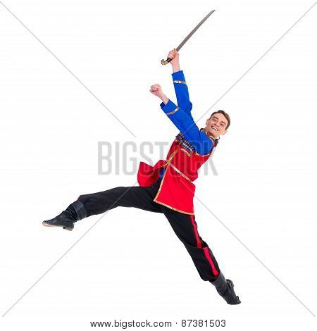 Russian cossack dance. Young dancer posing with sword