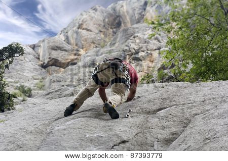 Climber On The Rock Wall