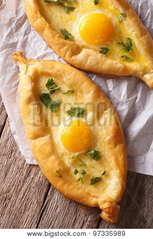 Ajarian Khachapuri, With Egg And Cheese Closeup. Vertical Top View