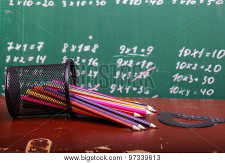 Colorful pencils of red yellow orange violet purple pink green and blue in stationary cup