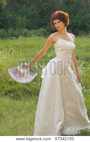 Young beautiful girl in a wedding dress