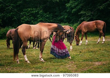 Beautiful gypsy in violet dress