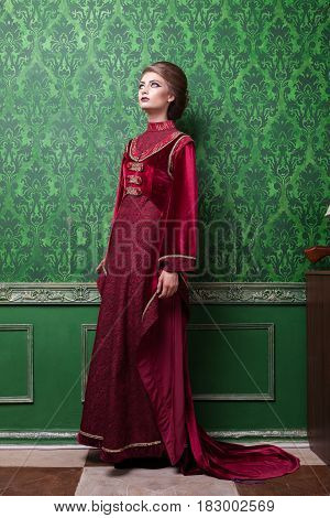Gorgeous woman dressed in vintage clothes in retro interior. Rococo period. Luxury and high class