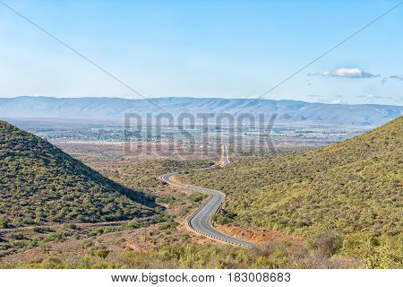 The end of the Huisrivier Pass on the scenic road R62 with Calitzdorp in the back as seen from the Matjiesvlei Pass