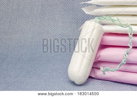 Soft tender protection for woman critical days gynecological menstruation cycle. Menstruation sanitary pads and cotton tampons for woman hygiene protection.