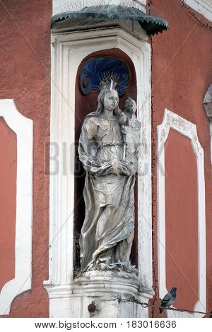 PTUJ, SLOVENIA - JULY 02: Virgin Mary with baby Jesus, statue on the house facade in Ptuj, town on the Drava River banks, Lower Styria Region, Slovenia on July 02, 2016.