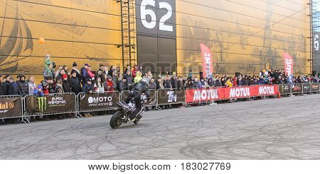 St. Petersburg Russia - 15 April, The biker rides along the spectators,15 April, 2017.
International Motor Show IMIS-2017 in Expoforurum.
Sports motorcycle show of bikers on the open area.