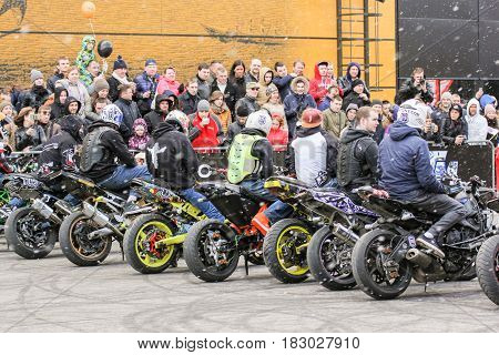 St. Petersburg Russia - 15 April, Bikers under the snow,15 April, 2017.
International Motor Show IMIS-2017 in Expoforurum.
Sports motorcycle show of bikers on the open area.