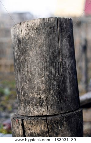 Stucked wooden logs close up. Firewoods on the ground.