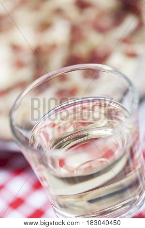 closeup of white wine and flammkuchen on the table