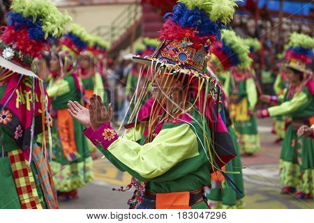 ORURO, BOLIVIA - FEBRUARY 26, 2017: Tinkus dancers in colourful costumes performing at the annual Oruro Carnival. The event is designated by UNESCO as being Intangible Cultural Heritage of Humanity.