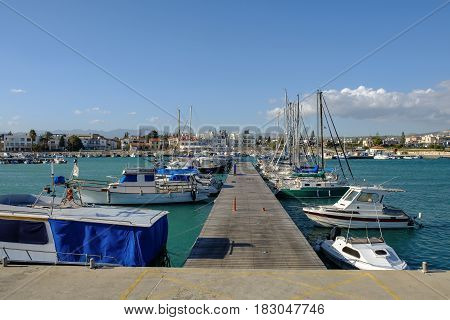 Wooden jetty at Zygi marina looking towards the fishing village