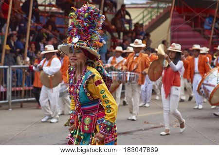 ORURO, BOLIVIA - FEBRUARY 26, 2017: Tinkus dancers in colourful costumes performing at the annual Oruro Carnival. The event is designated by UNESCO as being Intangible Cultural Heritage of Humanity.