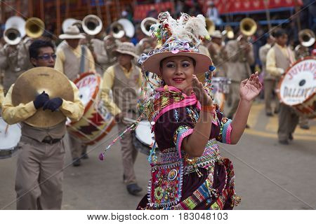 ORURO, BOLIVIA - FEBRUARY 26, 2017: Tinkus dancers in colourful costumes performing at the annual Oruro Carnival. The event is designated by UNESCO as being Intangible Cultural Heritage of Humanity.
