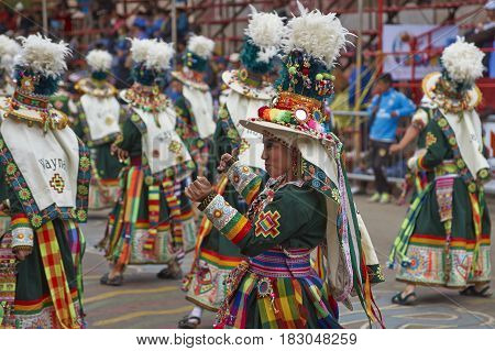 ORURO, BOLIVIA - FEBRUARY 26, 2017: Tinkus dancers in colourful costumes performing at the annual Oruro Carnival. The event is designated by UNESCO as being Intangible Cultural Heritage of Humanity.