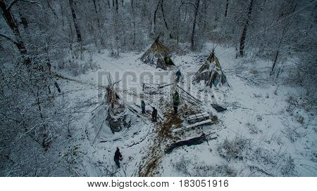Aerial view near of Kinderlinskaya cave and village Tash-Asty on Zilim river. Life in the tipi at winter