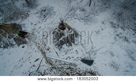 Aerial view near of Kinderlinskaya cave and village Tash-Asty on Zilim river. Life in the tipi at winter