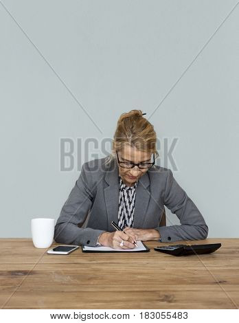 Businesswoman writing down a plan and strategy
