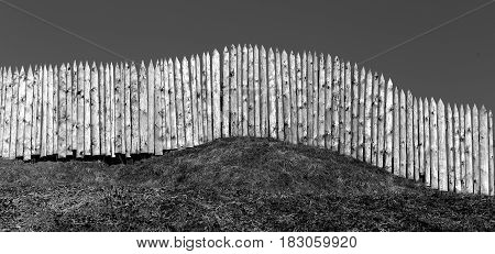 Photo background old wooden fences on the hills in the spring