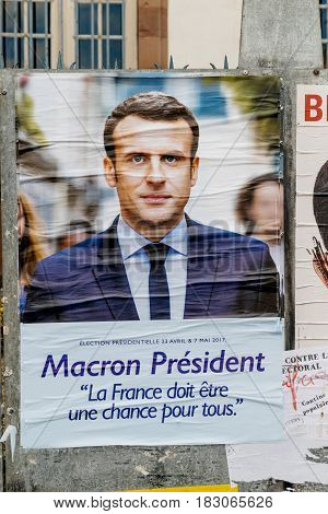 STRASBOURG FRANCE - APR 23 2017: Official campaign posters of Emmanuel Macron political party leader of En marche ! (EM !) on the first round of 2017 French presidential election